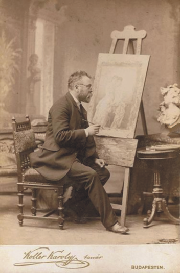 Koller sitting on a chair and painting.